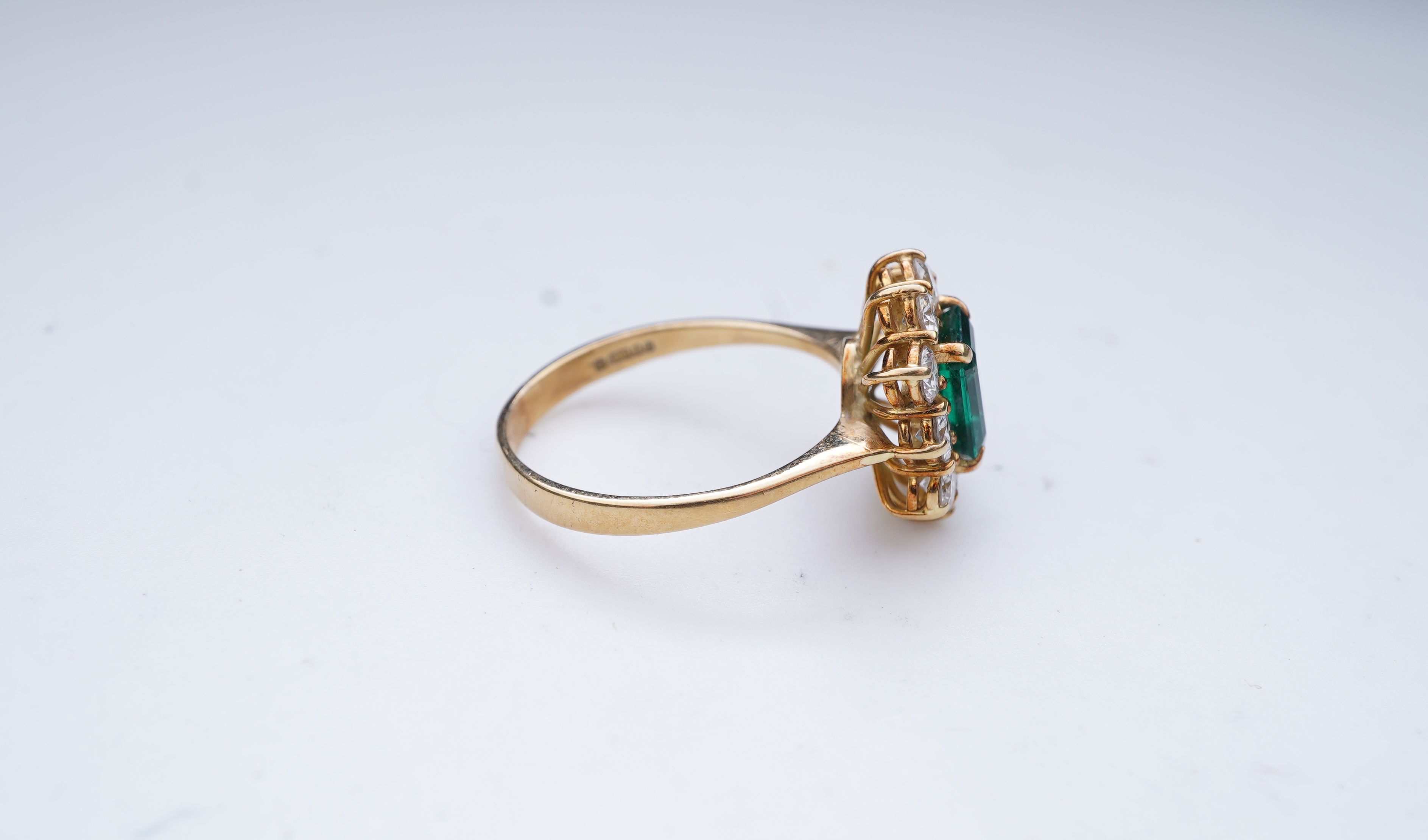 A synthetic emerald and diamond ring
